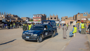 A police van parked in the rural Egyptian town of Edfu (Marlene Vicente / Shutterstock)