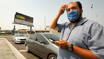 Uber driver Bernard Millan at a rally demanding that ride-hailing companies follow California law and grant drivers "basic employee rights" (Al Seib/Los Angeles Times/Shutterstock)