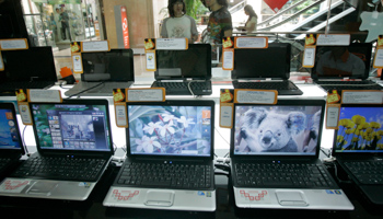 Indonesian shoppers browse for laptops at a mall in Jakarta, Indonesia (Irwin Fedriansyah/AP/Shutterstock)
