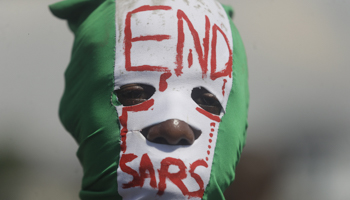 A protester demonstrating against police brutality in Lagos, Nigeria, October 18 (Sunday Alamba/AP/Shutterstock)