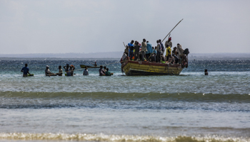 Passengers and cargo board a boat at a fishermen's beach in the Paquitequete district of Pemba, Cabo Delgado, July 21 (Ricardo Franco/EPA-EFE/Shutterstock)