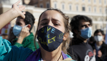Masked students attend a climate change rally in Rome, October (Gregorio Borgia/AP/Shutterstock)