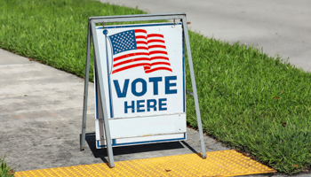 A voting sign near a polling station in Fort Lauderdale, Florida, United States (Shutterstock / Jillian Cain Photography)