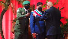 President Santokhi receiving the presidential sash from predecessor Desi Bouterse in July (Ertugrul Kilic/AP/Shutterstock)