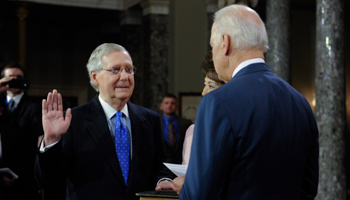 Then-Vice President Joe Biden swears in then-Senator Mitch McConnell in 2015 (Xinhua/Shutterstock)