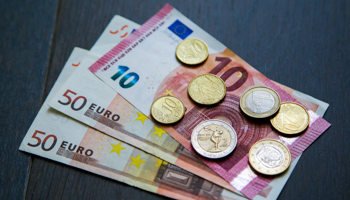 A collection of one and two Euro coins, ten and fifty Euro banknotes and ten cents (Dinendra Haria/SOPA Images/Shutterstock)
