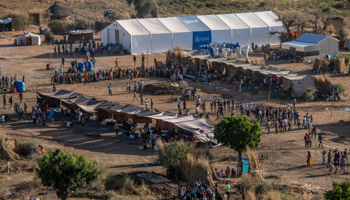 Tigrayan refugees queue for aid after crossing the border into Sudan, November 23 (Nariman El-Mofty/AP/Shutterstock)