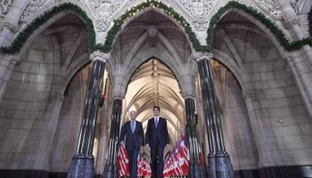 Prime Minister Justin Trudeau walks in Canada's parliament with then-US Vice President Joe Biden, December 9, 2016 (Canadian Press/Shutterstock)