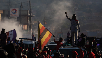 Bobi Wine greets supporters as he passes through Mukono, Kampala, November 30 (STR/EPA-EFE/Shutterstock)