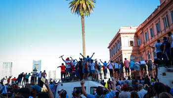 Fans outside Government House at the funeral of Diego Maradona (Santiago Menichelli/via ZUMA Wire/Shutterstock)