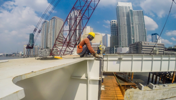 Construction workers building a bridge in Manila (Xinhua/Shutterstock)