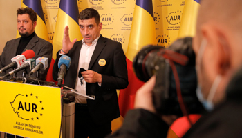 Alliance for Romanians’ Unity (AUR) leaders George Simion (centre) and Claudiu Tarziu address a press conference at party headquarters, Bucharest, December 7 (Vadim Ghirda/AP/Shutterstock)