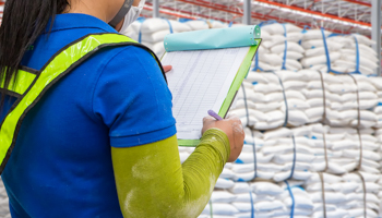 A warehouse worker during a stock check (Shutterstock/Sailom)