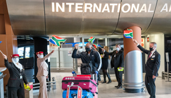 Travelers are welcomed at Cape Town International Airport as they arrive on the first international commercial flight to land in South Africa since lockdown on an Emirates airlines flight from Dubai, October 1 (Nic Bothma/EPA-EFE/Shutterstock)