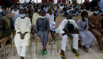 Freed schoolboys from the Government Science Secondary School in Kankara look on during a meeting with Nigeria's President Muhammadu Buhari in Katsina State, December 18 (Sunday Alamba/AP/Shutterstock)