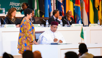 The President of Niger and leader of the CFTA Process, Mahamadou Issoufou signs the African Continental Free Trade Area (CFTA) Agreement during the 10th Extraordinary Session of the African Union (AU) in Kigali, Rwanda - 21 Mar 2018 (Uncredited/AP/Shutterstock)