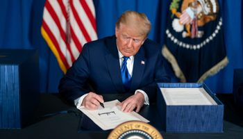 President Donald Trump signs legislation (White House/ZUMA Wire/Shutterstock)