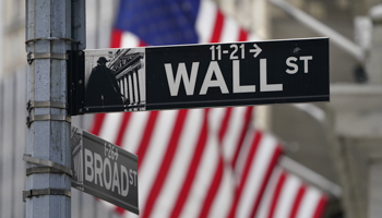 A street sign is displayed at the New York Stock Exchange in New York, November (Seth Wenig/AP/Shutterstock)