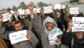 Iraqi Shia protesters with banners announcing “No to Biden” in 2010, over perceived support for Sunnis (Alaa Al-Marjani/AP/Shutterstock)