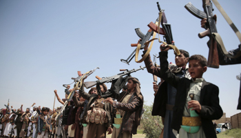 Pro-Huthi tribesmen raising their weapons, Sanaa (Hani Mohammed/AP/Shutterstock)