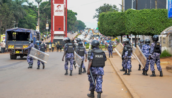 Police block the streets around the electoral commission during a visit by presidential candidate Bobi Wine (Ronald Kabuubi/AP/Shutterstock)