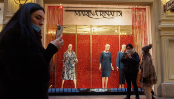 Shoppers outside an up-market fashion store in Moscow (Alexander Sayganov/SOPA Images/Shutterstock)