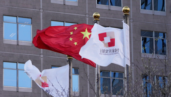 The flags for the China Development Bank are flown near a Chinese flag outside a subsidiary branch office of the Bank in Beijing (Ng Han Guan/AP/Shutterstock)