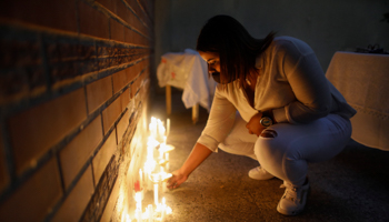 A candlelit vigil for Venezuelan migrants who drowned while trying to reach Trinidad and Tobago (Ariana Cubillos/AP/Shutterstock)