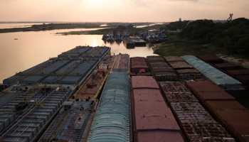 Empty grain barges and tugs moored on the Paraguay River during the COVID-19 lockdown (Jorge Saenz/AP/Shutterstock)