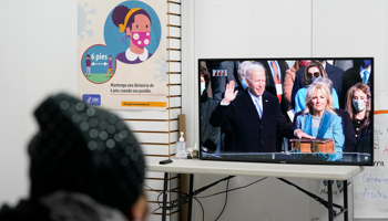 Salvadoran nanny Blanca Cedillos watches Biden’s inauguration from the Workers Justice Center, an immigrants rights organization in New York (Kathy Willens/AP/Shutterstock)