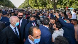  President Kais Saied listens to a Tunisians on Habib Bourguiba avenue, February (Slim Abid/AP/Shutterstock)