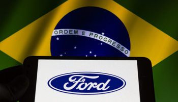 Ford logo against the background of the Brazilian flag (Andre M Chang/ZUMA Wire/Shutterstock)