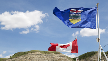 The Alberta and Canada flags (Stuart Forster/Shutterstock)