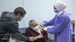 Caption: COVID-19 inoculation in Cairo, Egypt (Nariman El-Mofty/AP/Shutterstock)