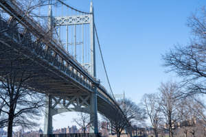 The Triborough Bridge (known officially as the Robert F. Kennedy Bridge, and also known as the RFK Bridge) seen high above Astoria Park in Queens, New York (Ron Adar/SOPA Images/Shutterstock)