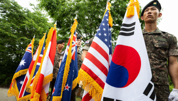 South Korean soldiers in a memorial ceremony hold the flags of countries who fought alongside South Korea during the Korean War (Jeon Heon-Kyun/EPA-EFE/Shutterstock)