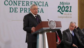AMLO speaks next to CFE Director Manuel Bartlett during a press conference, following blackouts in Northern Mexico. Mexico City, February, 2021 (Photo by Eyepix/NurPhoto)
