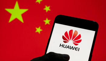 Huawei logo seen on an Android smartphone with the Chinese flag in the background (Budrul Chukrut/SOPA Images/Shutterstock)