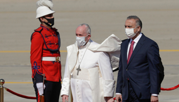 Iraqi Prime Minister Mustafa al-Kadhimi welcomes Pope Francis to Baghdad, March 5 (Andrew Medichini/AP/Shutterstock)