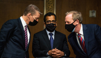 FireEye CEO Kevin Mandia, SolarWinds CEO Sudhakar Ramakrishna and Microsoft President Brad Smith speak with each other before the start of a Senate Intelligence Committee hearing on Capitol Hill in February 2021 about the SolarWinds hack (Drew Angerer/UPI/Shutterstock)