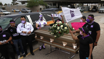 Supporters of Social Encounter Party (PES) candidate for federal deputy Carlos Mayorga stand at a coffin representing violence in Mexico, Ciudad Juarez, April (Luis Torres/EPA-EFE/Shutterstock)