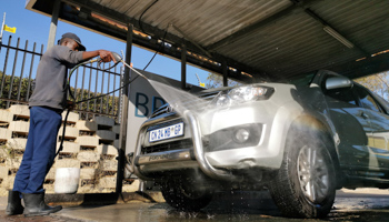 A worker washes a car in Johannesburg, South Africa, June 22 (Xinhua/Shutterstock)