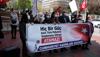 Protesters hold banner reading, "No power can slander the Turkish people with genocide!" outside the US embassy, Ankara, April 27 (Ozbilici/AP/Shutterstock).