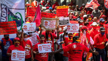 Members of the Congress of South African Trade Unions (COSATU) protest during a nationwide strike in Cape Town, South Africa, October 7, 2020 (NIC BOTHMA/EPA-EFE/Shutterstock)