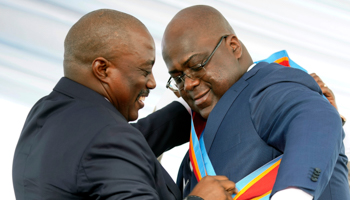 President Felix Tshisekedi receives the presidential sash from outgoing President Joseph Kabila, January 24, 2019 (Jerome Delay/AP/Shutterstock)
