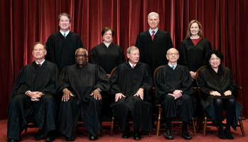 Members of the Supreme Court pose for a group photo at the Supreme Court in Washington, DC (Shutterstock)