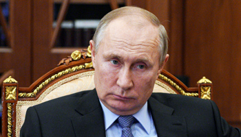 President Vladimir Putin listens to Russia's official human rights ombudsman (Alexei Druzhinin/AP/Shutterstock) 