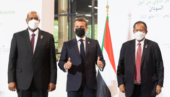 French President Emmanuel Macron hosts Sudan's Sovereign Council Chairman Abdel Fattah al-Burhan and Prime Minister Abdallah Hamdok at the Paris Conference for Sudan, May 17 (Jacques Witt/SIPA/Shutterstock)