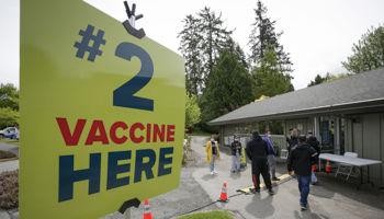 People wait for vaccination at a pop-up vaccine clinic in Surrey, British Columbia, on May 17, 2021 (CHINE NOUVELLE/SIPA/Shutterstock)