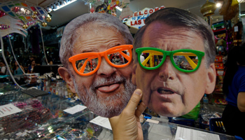 Masks of President Jair Bolsonaro and former President Lula da Silva sold ahead of last year's Carnival celebrations (Cris Faga/Shutterstock)